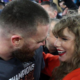 Taylor Swift Hugs Travis Kelce after game - Copy