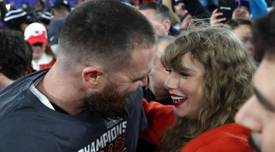 Taylor Swift Hugs Travis Kelce after game - Copy