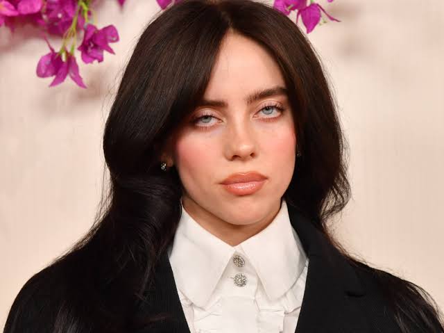 Billie Eilish stuns fans with a daring selfie, fueling speculation after being spotted with a mystery blonde.